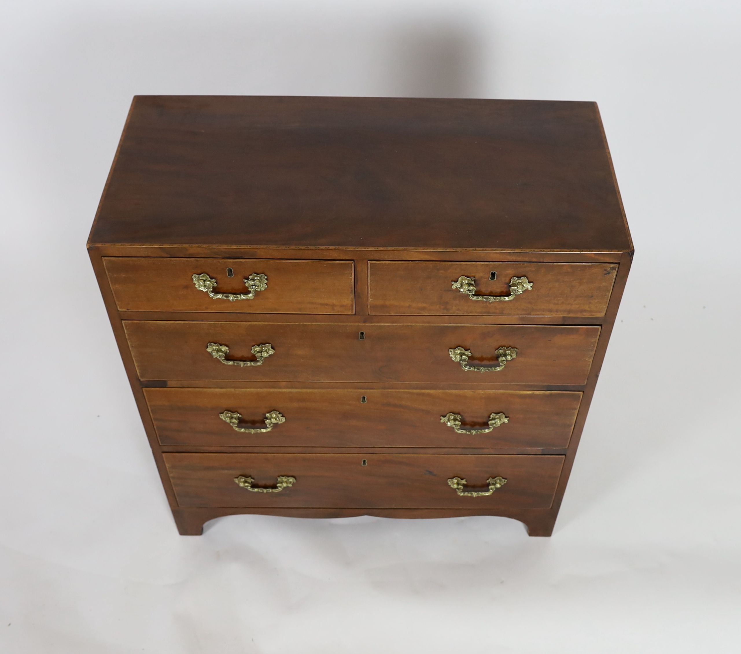A George III inlaid mahogany chest, width 89cm depth 42cm height 95cm